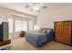 Spacious bedroom with a large window and built-in wardrobe at 14623 W Hearn Rd, Surprise, AZ 85379