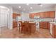 Bright kitchen with an island and ample cabinetry at 14623 W Hearn Rd, Surprise, AZ 85379