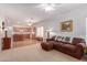 Open living room with a view into the kitchen at 14623 W Hearn Rd, Surprise, AZ 85379