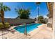 Inviting backyard oasis with a refreshing pool and patio at 14623 W Hearn Rd, Surprise, AZ 85379