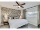 Bedroom with king-size bed and geometric patterned wall at 8247 E Devonshire Ave, Scottsdale, AZ 85251
