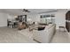 Open concept living space featuring a comfortable sectional sofa and kitchen view at 8247 E Devonshire Ave, Scottsdale, AZ 85251
