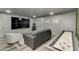 Game room with large screen TV and shuffleboard at 8247 E Devonshire Ave, Scottsdale, AZ 85251