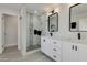 Modern bathroom with double vanity and a walk-in shower at 8247 E Devonshire Ave, Scottsdale, AZ 85251