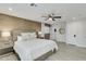 Spacious bedroom with a king-size bed and wood-look flooring at 8247 E Devonshire Ave, Scottsdale, AZ 85251