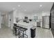 Modern kitchen with white cabinets, stainless steel appliances, and a large island at 8247 E Devonshire Ave, Scottsdale, AZ 85251