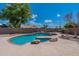 Inviting kidney shaped pool with flagstone decking at 9859 W Potter Dr, Peoria, AZ 85382