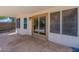 Covered patio with sliding glass doors leading to the backyard at 9859 W Potter Dr, Peoria, AZ 85382