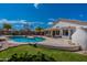 Home exterior showcasing a sparkling pool and grassy area at 9859 W Potter Dr, Peoria, AZ 85382