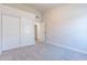 Bedroom with double door closet and access to the hallway at 9859 W Potter Dr, Peoria, AZ 85382