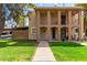 Two-story building with balconies and a grassy yard at 7126 N 19Th Ave # 173, Phoenix, AZ 85021