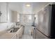 View of kitchen with stainless steel refrigerator and microwave at 7126 N 19Th Ave # 173, Phoenix, AZ 85021