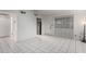 Living room with tile floors and access to kitchen and exterior at 7126 N 19Th Ave # 173, Phoenix, AZ 85021