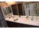 Double vanity bathroom with a large mirror and a shower at 1255 N Arizona Ave # 1099, Chandler, AZ 85225