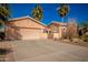 Tan one-story house with a two-car garage and drought-tolerant landscaping at 42616 W Kingfisher Dr, Maricopa, AZ 85138