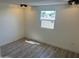 Well-lit bedroom with wood-look floors and simple white walls at 7300 N 51St Ave # 160, Glendale, AZ 85301