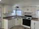 Updated kitchen features white cabinets, new appliances, and modern countertops at 7300 N 51St Ave # 160, Glendale, AZ 85301