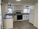 Clean and efficient kitchen with white cabinets at 7300 N 51St Ave # 160, Glendale, AZ 85301