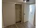 Bedroom with mirrored closet doors and wood-look floors at 7300 N 51St Ave # 160, Glendale, AZ 85301