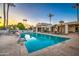 Inviting community pool with lounge chairs and palm trees at 7252 N Via De La Montana --, Scottsdale, AZ 85258