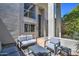 Private patio with modern gray seating and a glass-top coffee table at 7252 N Via De La Montana --, Scottsdale, AZ 85258