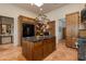 Spacious kitchen with large island, wooden cabinetry, and modern appliances at 42311 N Sierra Vista Rd, Cave Creek, AZ 85331