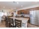 Open concept kitchen with island, stainless steel appliances, and ample cabinet space at 21667 S 225Th Way, Queen Creek, AZ 85142