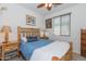 Rustic bedroom with log bed frame and wood accents at 21667 S 225Th Way, Queen Creek, AZ 85142