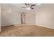 Spacious living room with tile flooring and ceiling fans at 10318 W Desert Forest Cir, Sun City, AZ 85351