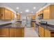 Open concept kitchen boasts stainless steel appliances and dark countertops at 10318 W Desert Forest Cir, Sun City, AZ 85351