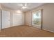 Spacious bedroom with double door closet and window at 10318 W Desert Forest Cir, Sun City, AZ 85351