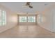Sunroom with tile floors, plantation shutters, and French doors at 10318 W Desert Forest Cir, Sun City, AZ 85351