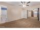 Bright bedroom with mirrored closet doors and en-suite bathroom at 10318 W Desert Forest Cir, Sun City, AZ 85351