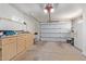 Attached garage with built-in workbench and storage at 10318 W Desert Forest Cir, Sun City, AZ 85351