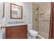 Updated bathroom with granite vanity and tiled shower at 10318 W Desert Forest Cir, Sun City, AZ 85351