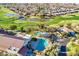 Aerial view of community pool, clubhouse, and landscaping at 4528 E Donato Dr, Gilbert, AZ 85298