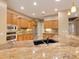 Kitchen with granite countertops, stainless steel appliances, and wood cabinets at 4528 E Donato Dr, Gilbert, AZ 85298