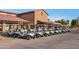 Row of golf carts parked outside clubhouse at 4528 E Donato Dr, Gilbert, AZ 85298