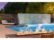 Luxury pool with fire pit, water feature, and comfortable seating at 12651 S 71St St, Tempe, AZ 85287