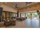 Outdoor patio with seating area, dining table, and access to backyard at 12651 S 71St St, Tempe, AZ 85287