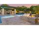 Relaxing spa and fire pit area near the pool and outdoor kitchen at 12651 S 71St St, Tempe, AZ 85287