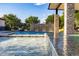 Resort-style pool with waterfall feature, spacious patio, and seating area at 12651 S 71St St, Tempe, AZ 85287