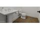 Classic bathroom with pedestal sink and toilet at 12651 S 71St St, Tempe, AZ 85287