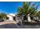 Stunning Spanish-style home with a paved driveway and mature landscaping at 12651 S 71St St, Tempe, AZ 85287