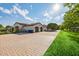 Luxury home exterior with a large driveway and beautifully landscaped lawn at 12651 S 71St St, Tempe, AZ 85287