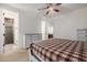 Cozy bedroom with plaid bedding and en-suite bathroom at 12651 S 71St St, Tempe, AZ 85287