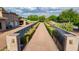 Private gated entrance with long driveway and landscaping at 12651 S 71St St, Tempe, AZ 85287