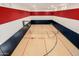 Indoor basketball and tennis court with hardwood flooring at 12651 S 71St St, Tempe, AZ 85287