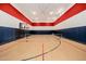 Indoor basketball and tennis court with hardwood flooring at 12651 S 71St St, Tempe, AZ 85287