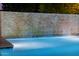 Serene waterfall feature adjacent to the pool at 12651 S 71St St, Tempe, AZ 85287